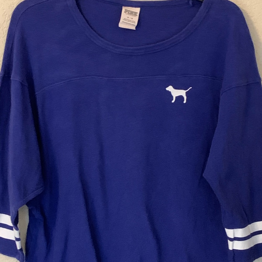 Pink jersey type top.